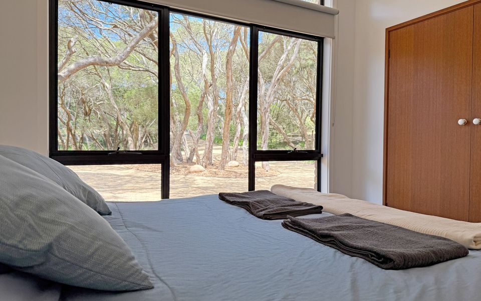 Master bedroom equipped with ceiling fan, double wardrobe and ensuite