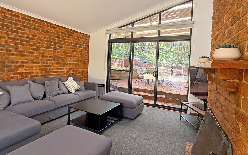 Open, light-filled lounge with smart TV and easy access to the outdoor covered dining and BBQ area.