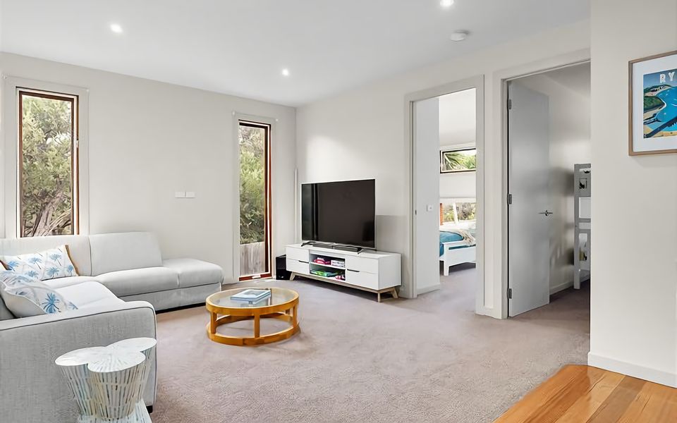 Second lounge perfect for the kids to hang out in with sofa and TV.