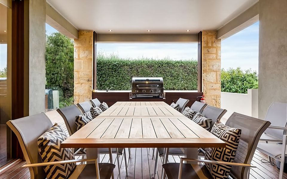 Sheltered dining for up to 12 people and built-in gas BBQ.
