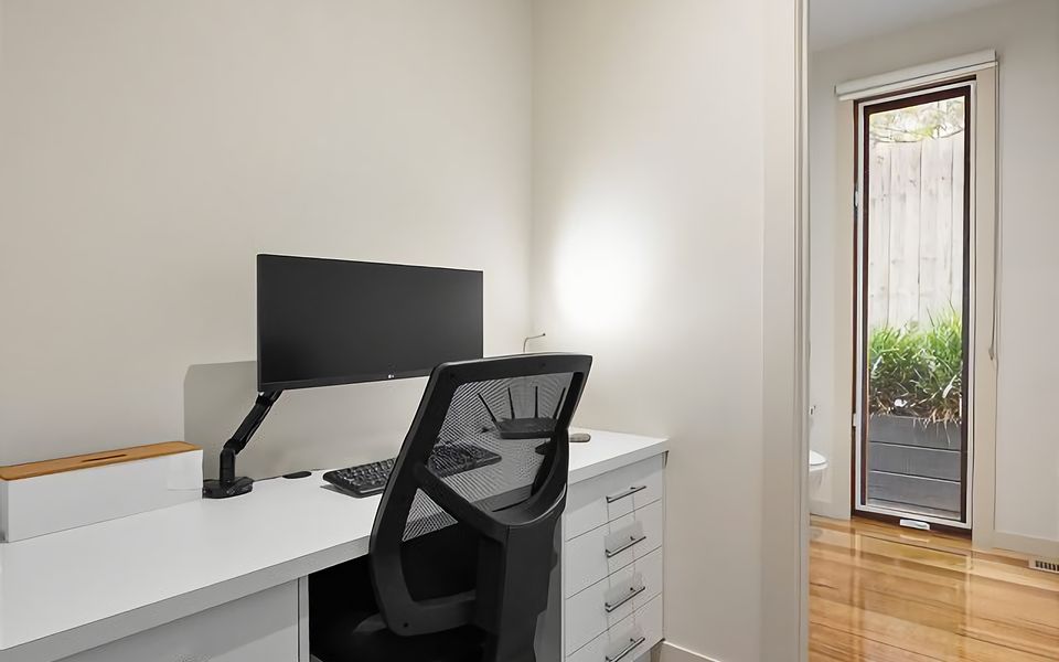 Private study area with adjoining powder room.