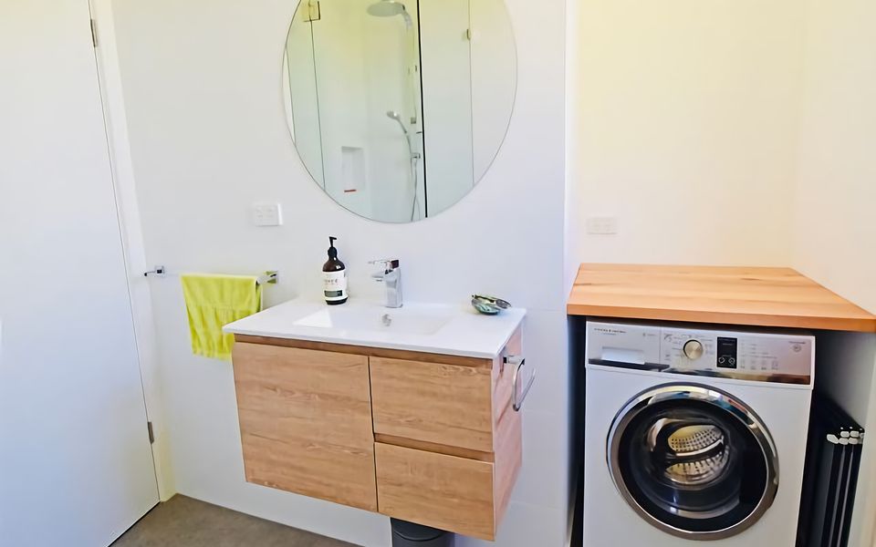Bathroom with European Style Laundry.