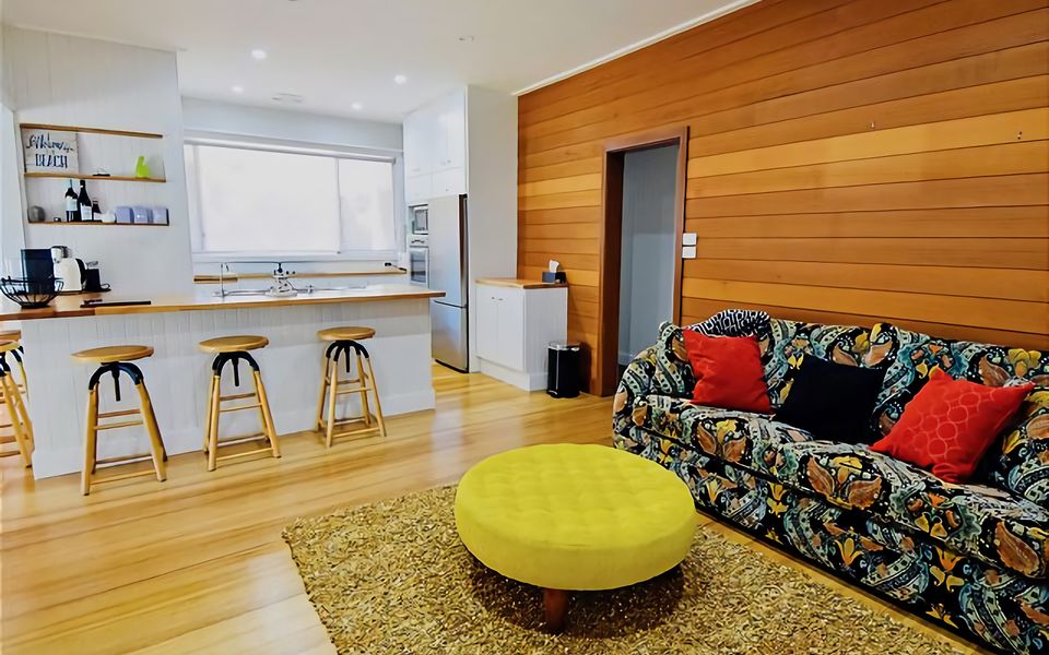 Second cozy living area with couch, perfect for getting together while a meal is being prepared.