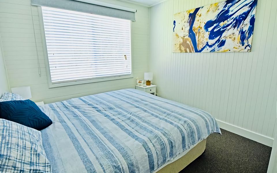 Unwind from a busy day in this Queen bed room.