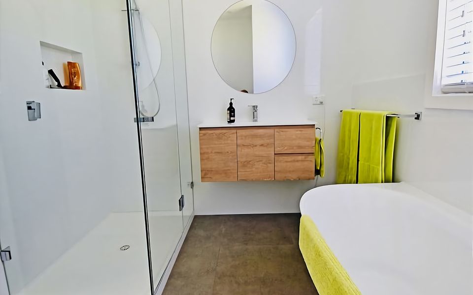 Main Bathroom with shower and bath.