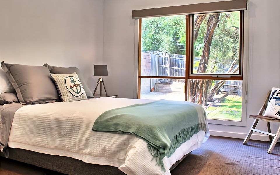 Sleep in comfort in this Queen bed bedroom.