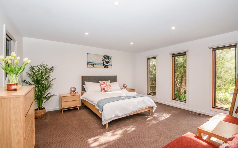 Spacious master bedroom on the ground floor with very comfortable Queen bed, WIR, TV, and ensuite with shower, vanity and toilet.