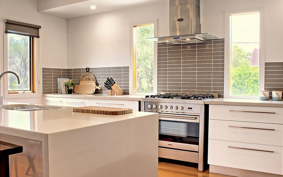 Open plan living space with large fully-equipped open kitchen with lots of natural light.