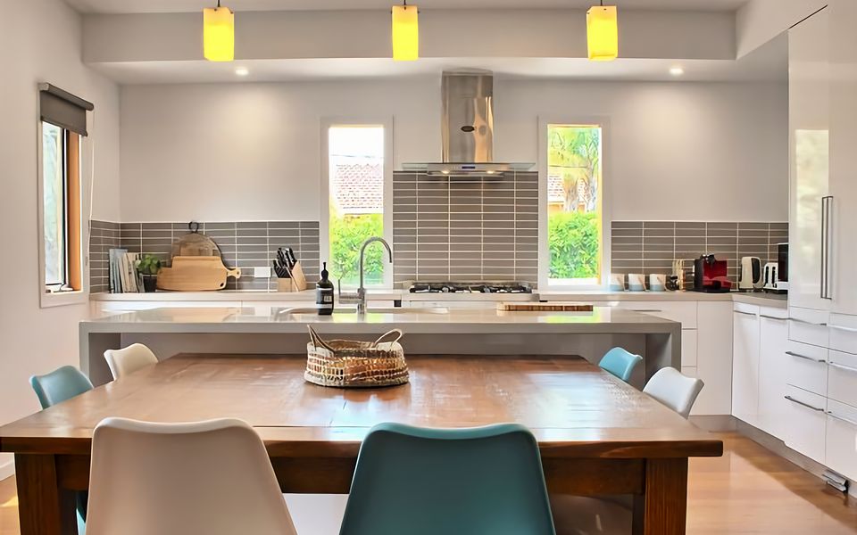 Huge kitchen island overlooking two dining areas.