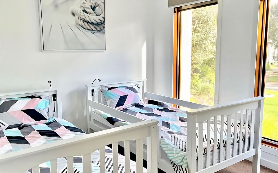 Indulge in a restful night's sleep in our charming bedroom, furnished with two single beds.