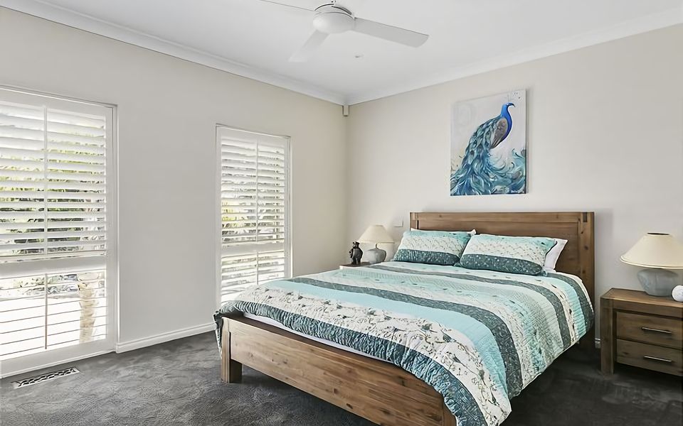 Unwind in our serene bedroom with a queen bed and private ensuite bathroom.