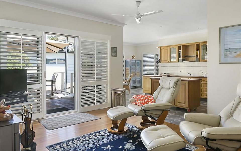 Comfortable family room with lay back leather chairs and a wood fired heater for comfort and ambience.