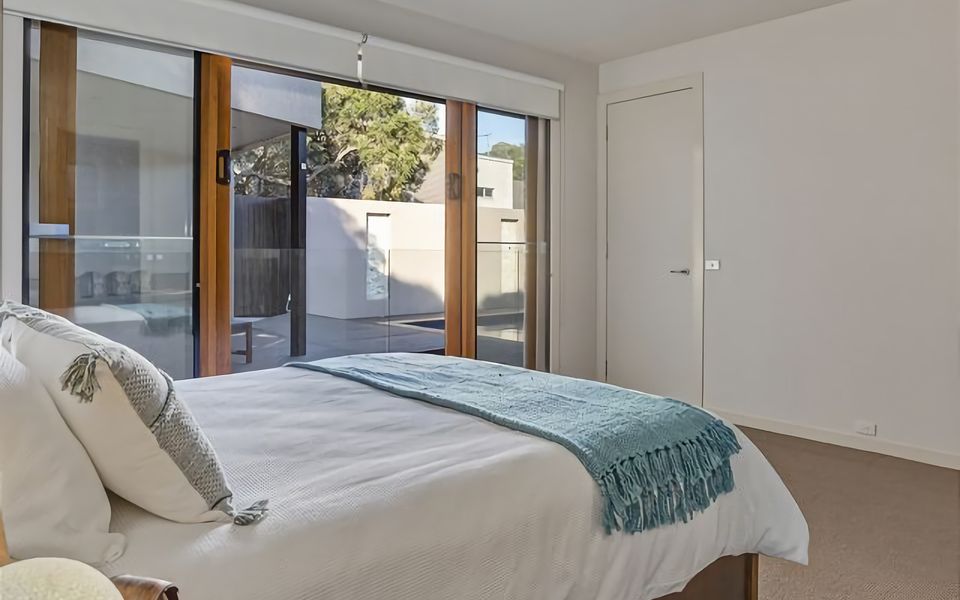 Indulge in comfort and tranquility in this inviting space. The queen bed provides a restful escape, while the ensuite bathroom offers a modern shower and premium amenities. Embrace the serenity of your private oasis for a truly delightful stay.