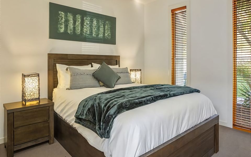 Relax and rejuvenate in our carefully curated bedroom, offering a queen bed with a plush mattress, promising a serene and comfortable night's sleep.