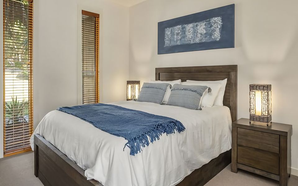 Experience ultimate comfort in our inviting bedroom, furnished with a spacious queen bed, offering a restful haven after a day of exploring.