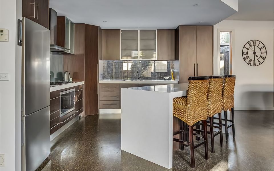 Our stylish kitchen complete with a sleek breakfast bar that's perfect for enjoying your morning coffee