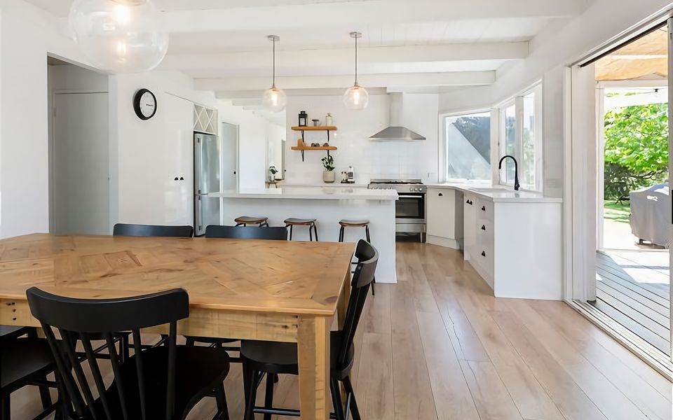 Open plan living, dining and kitchen leading into the conservatory.