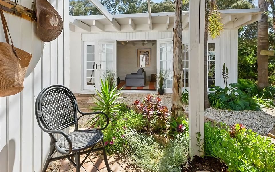 Courtyard at entrance to house with views of the garden