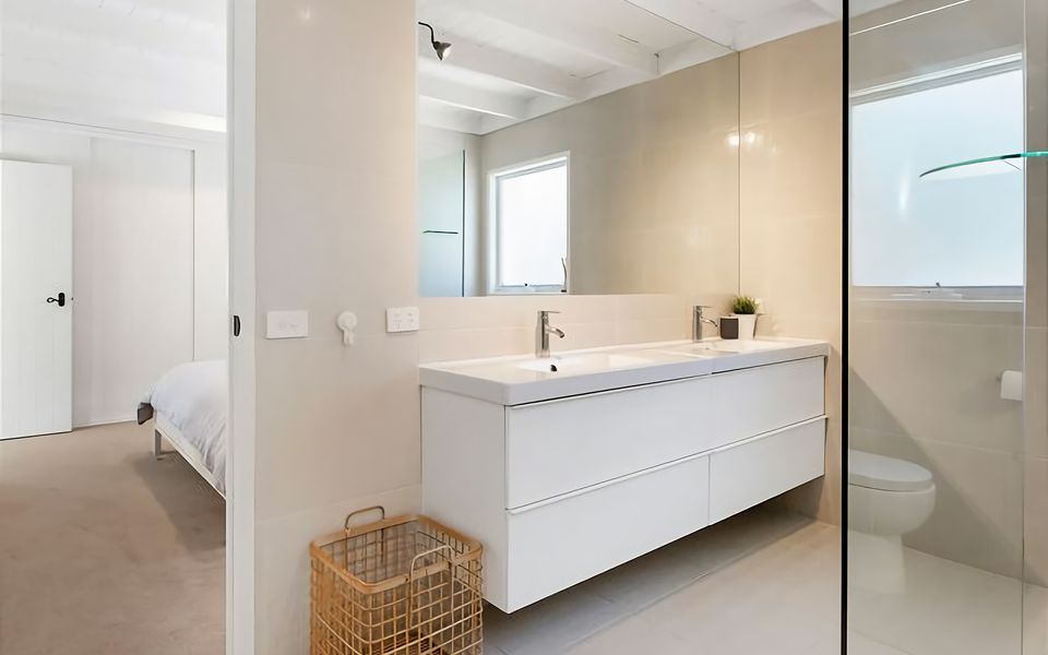 Master bedroom ensuite with large walk in shower, double vanity and toilet