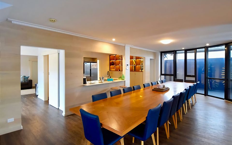 Large dining area that accommodates 18 people.