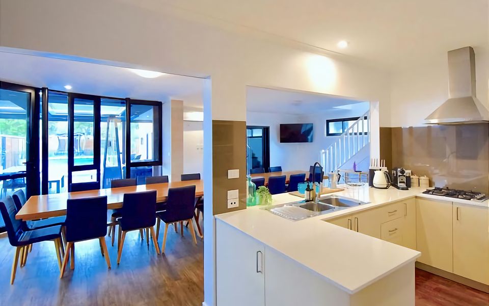 Open kitchen with large breakfast bench.