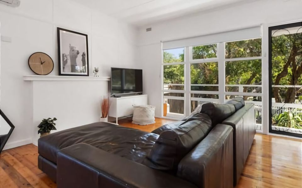 Lounge with comfortable couch and TV.