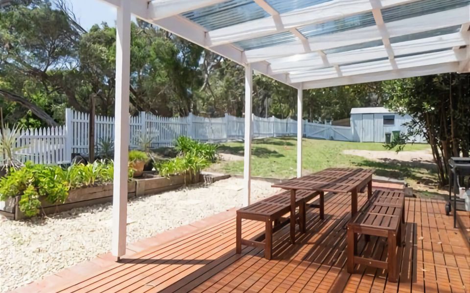 Outdoor patio with pergola, BBQ and 10 seat alfresco setting.