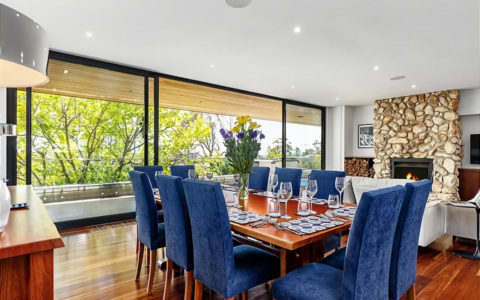 Hand-made timber dining table with seating for up to 12 people.