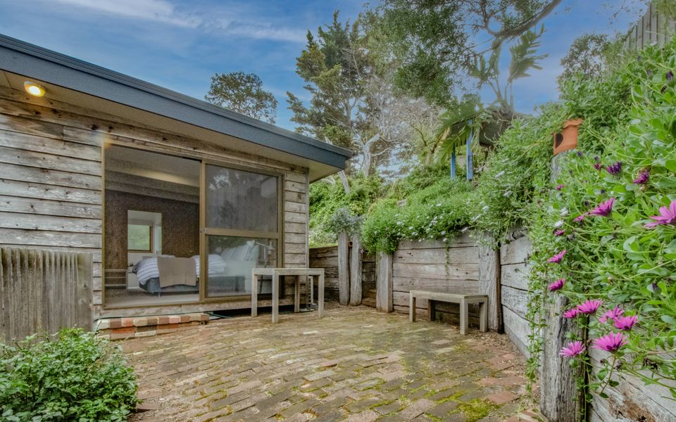 Private patio with seating for two and access to the master bedroom, perfect for that morning cuppa.
