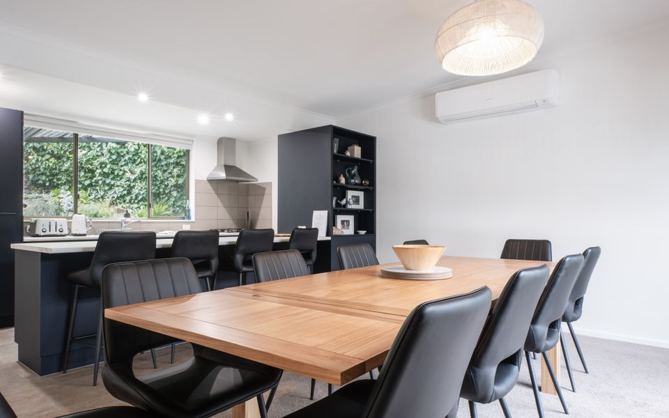 Dining area with room for 8, with a heating and cooling split system.