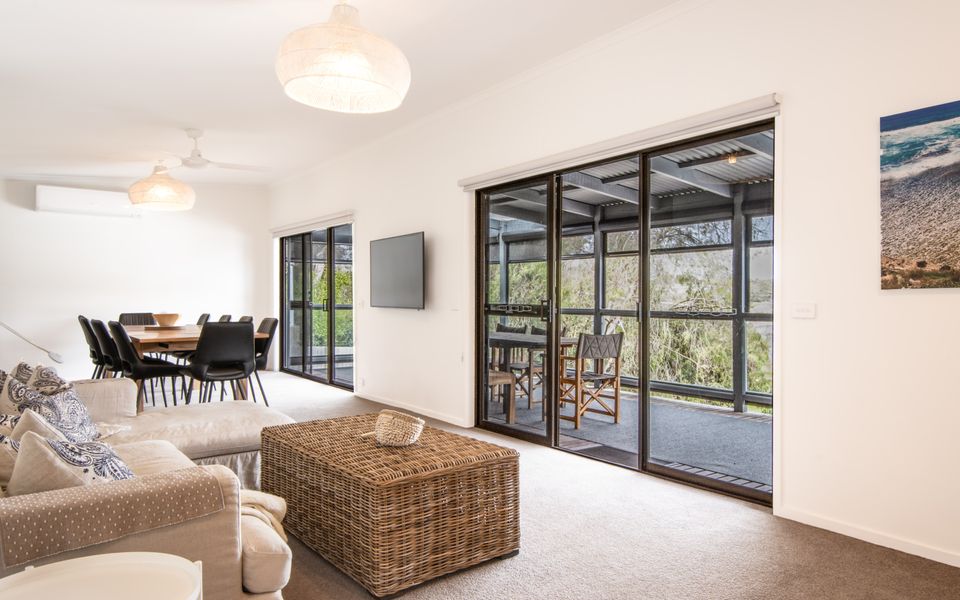 Open plan living dining area with access to the balcony.