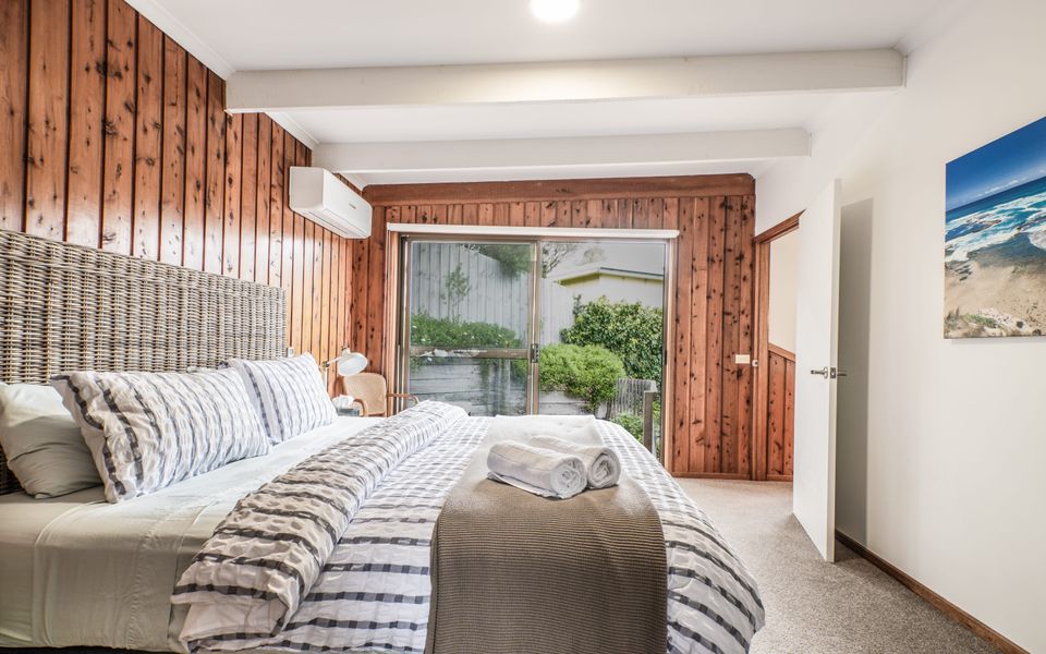 Master Bedroom- with King Bed, ensuite, split system, access to private courtyard with seating for two.