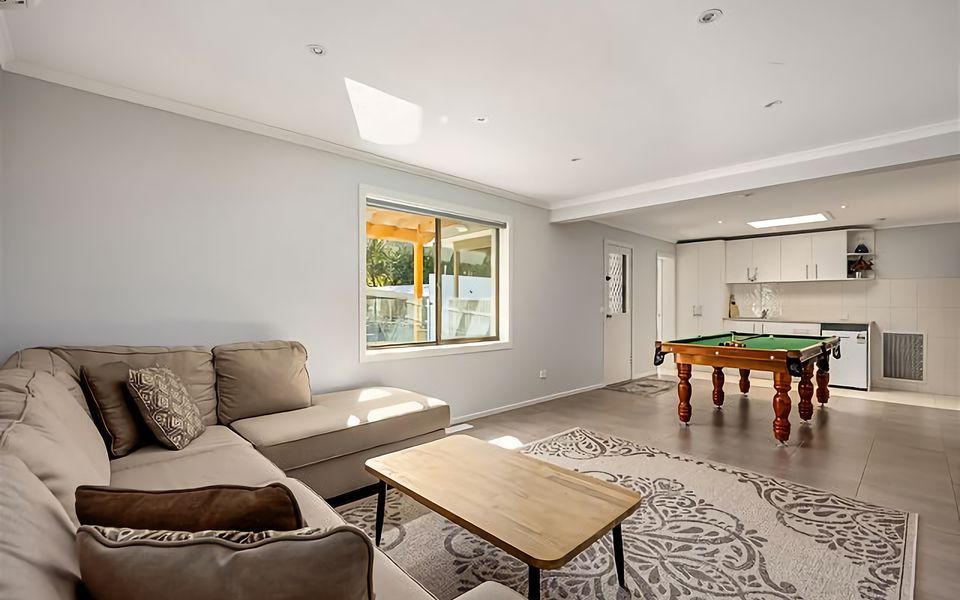 Large family room with Pool Table and kitchenette.