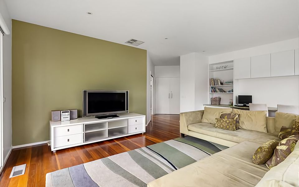 A cozy lounge area perfect for the kids to claim, with couch, TV, sound system, desk area, books and games.