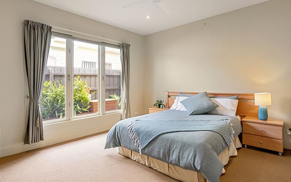 2nd Bedroom with Queen bed, air conditioning, and ceiling fan.