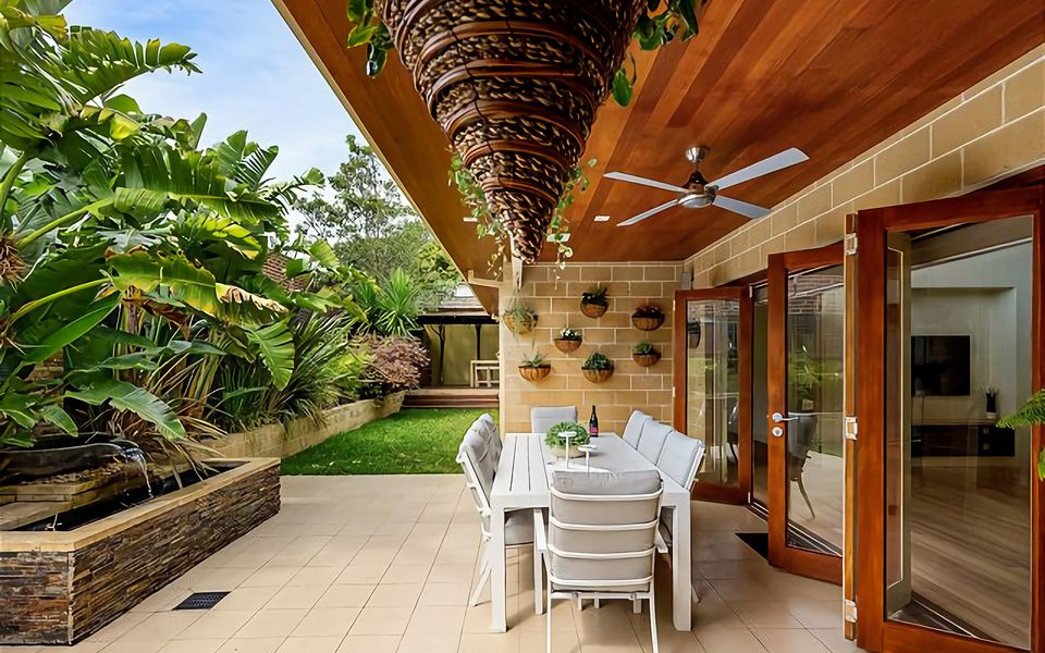 Sheltered alfresco dining for 8 people.