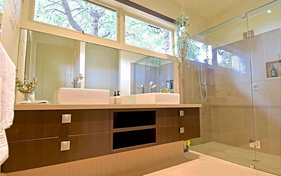 Ensuite bathroom with double basin, shower, and toilet.