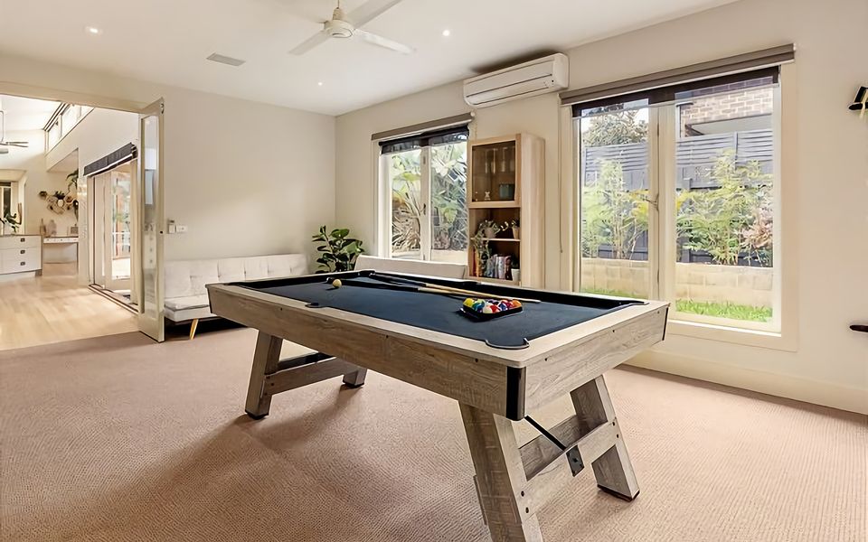 Games room with pool table and patio access.