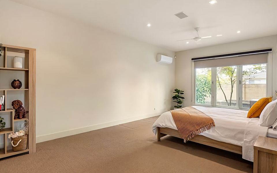 Master bedroom with Queen bed, air conditioning, desk, ceiling fan, WIR, and ensuite.