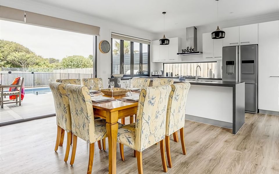 Meals can be enjoyed at the 8 seat inside dining table.