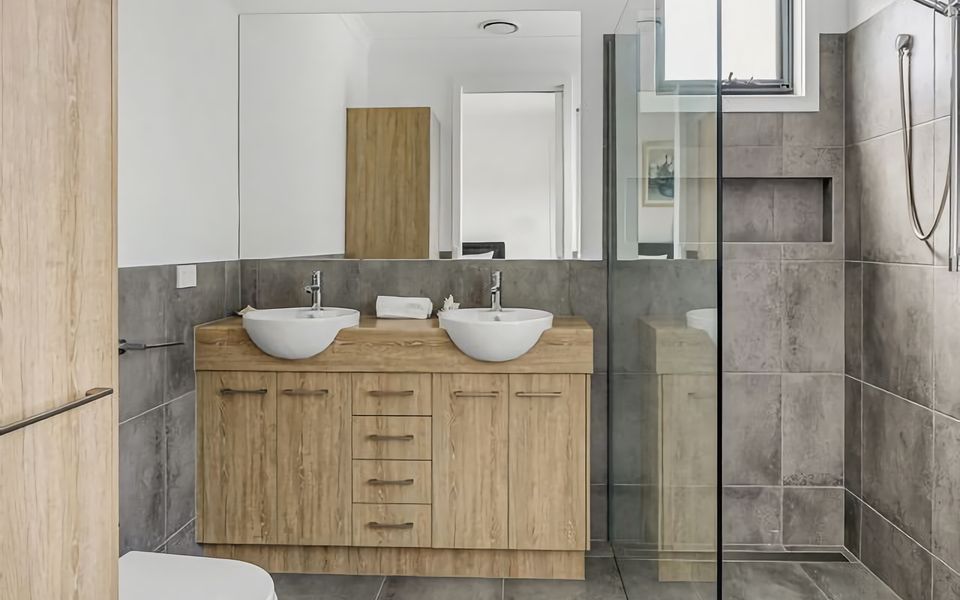 Ensuite with shower, toilet and double vanity.