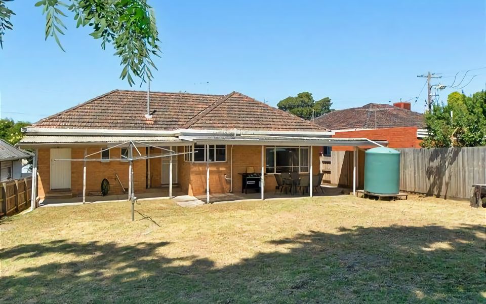 Enjoy the space of a generous sized fully enclosed back yard with ample lawn space for kicking around a ball.