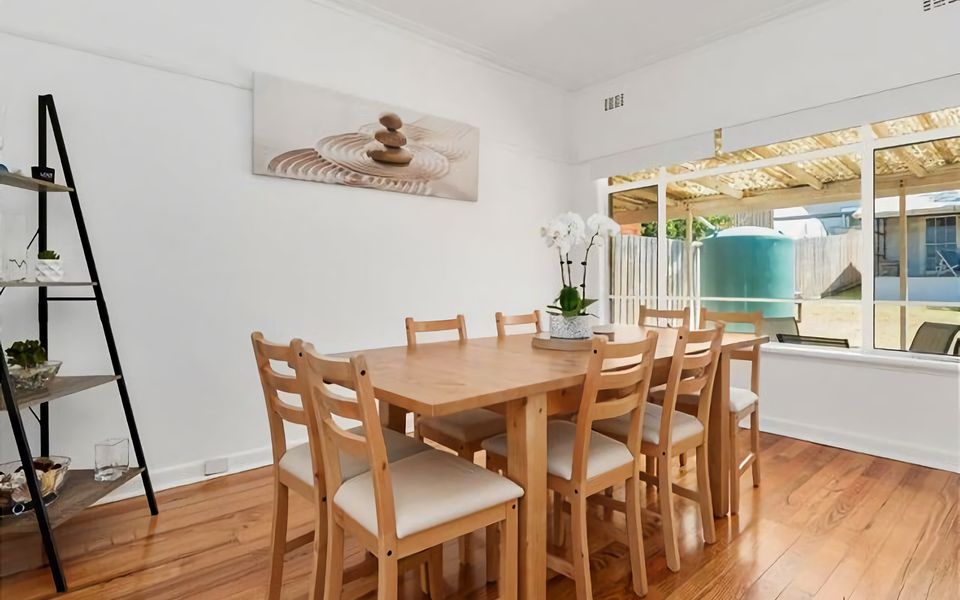 Open plan living/dining with generous dining table.