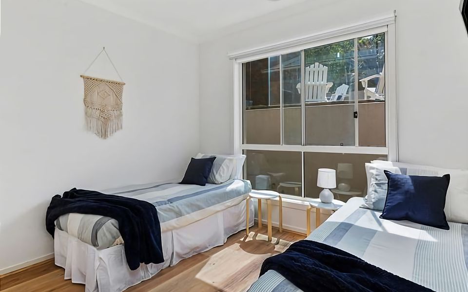 Experience a peaceful retreat in our cozy bedroom, featuring two single beds, allowing guests to rest and rejuvenate in utmost comfort.