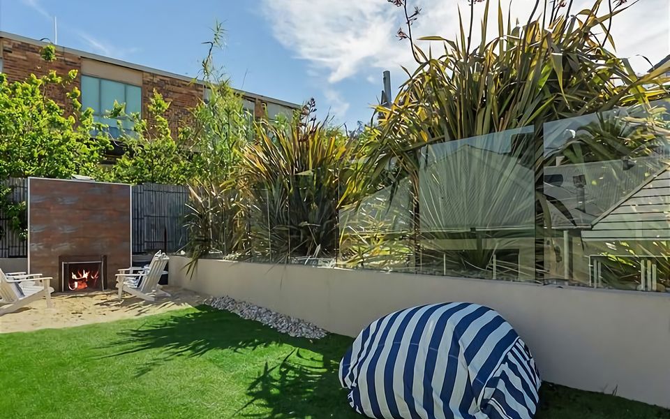 Immerse yourself in the beauty of nature while enjoying the comfort of our outdoor fireplace, creating the perfect setting for relaxation.