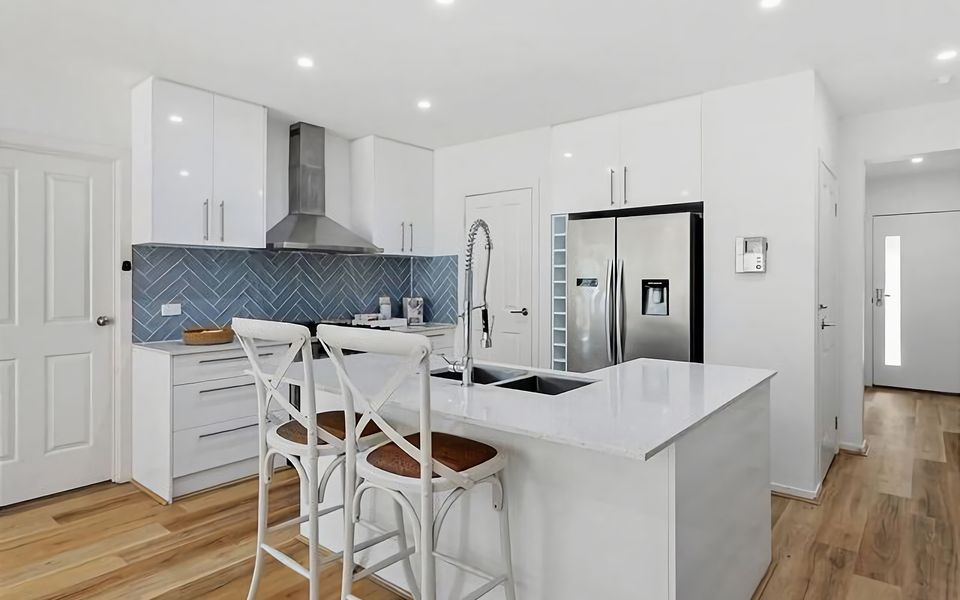 A modern and well-equipped kitchen with sleek stainless steel appliances.
