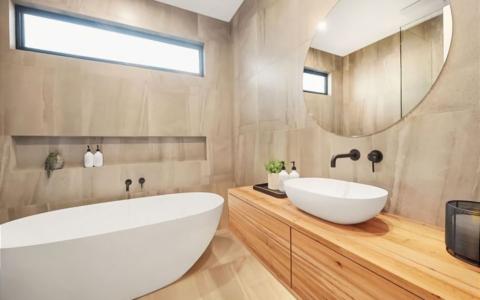 Main bathroom with bath, shower, handbasin and separate toilet.