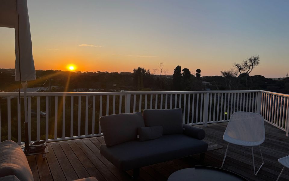 Large sundrenched deck offers a spectacular 270 degree view over the treetops towards the back beach dunes.