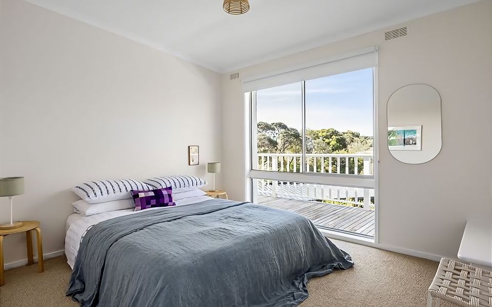 Bedroom with Queen bed and a view.