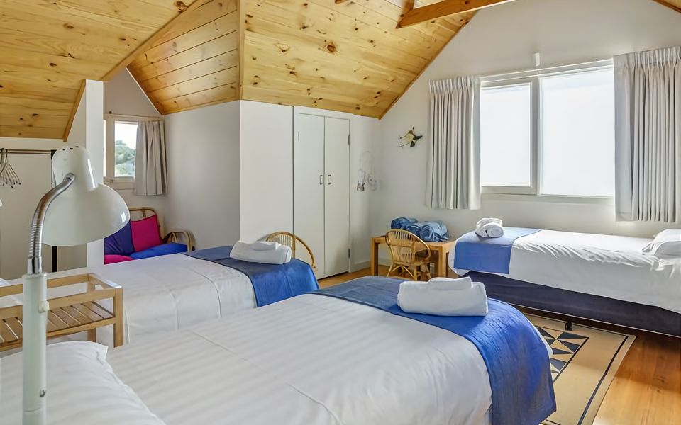 Second bedroom with 3 cosy single beds.